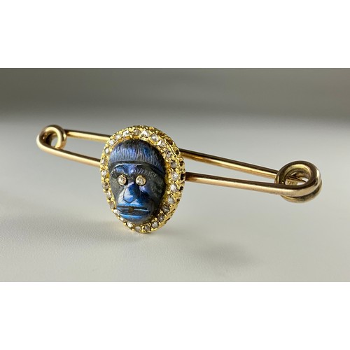 171 - A Victorian yellow and rose gold carved labradorite and diamond monkey mask brooch, the carved labra... 