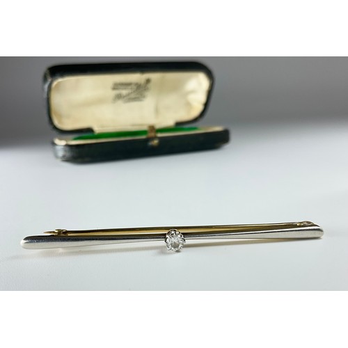 151 - A tested 9ct yellow and white gold diamond set bar brooch, set with a round brilliant cut diamond me... 
