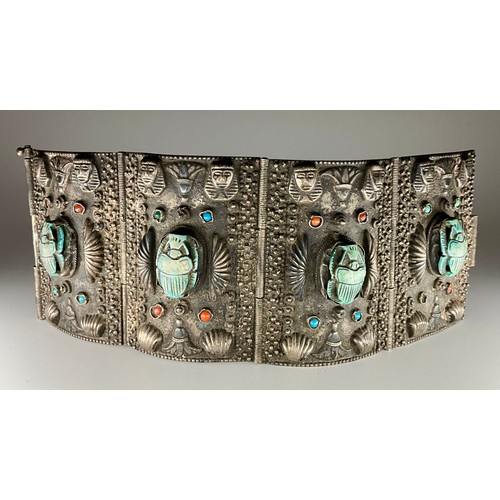 152 - A tested silver Egyptian Revival scarab cuff bracelet, 
possibly 900 grade silver, made up of four r... 
