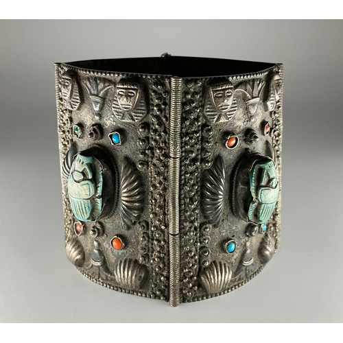 152 - A tested silver Egyptian Revival scarab cuff bracelet, 
possibly 900 grade silver, made up of four r... 