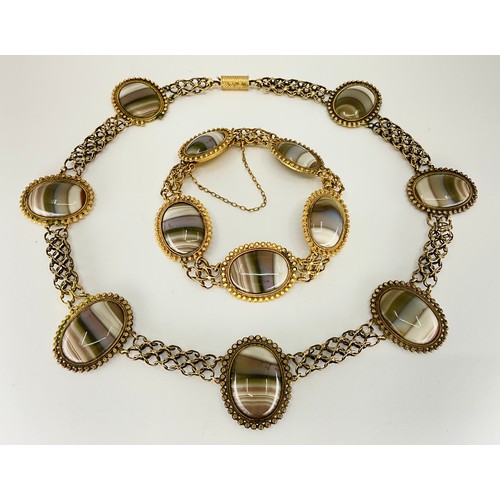 162 - A Victorian pinchbeck banded agate necklace and bracelet suite, 
the necklace set with seven oval ca... 