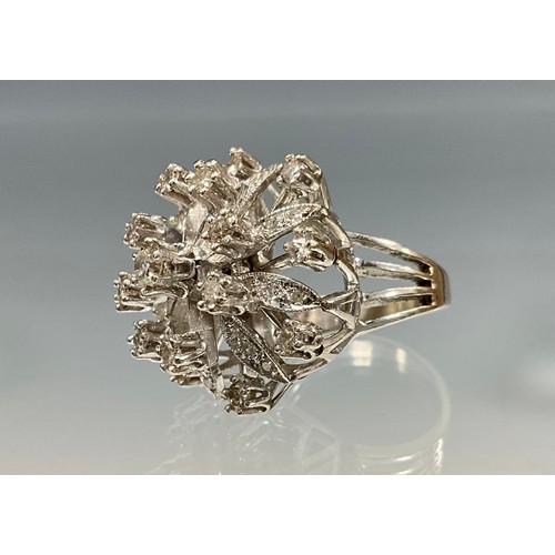 205 - An unmarked white metal diamond cluster ring, open multi-layer floral crest set with forty one round... 