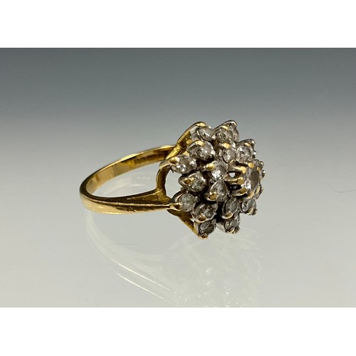 177 - An 18ct gold diamond cluster ring, set with an approx. 0.08ct round brilliant cut diamond in the cen... 