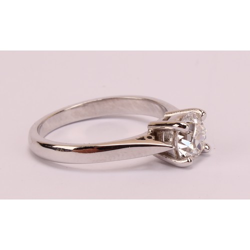 184 - An 18ct white gold and platinum diamond solitaire ring, 18ct white gold mount with platinum four cla... 