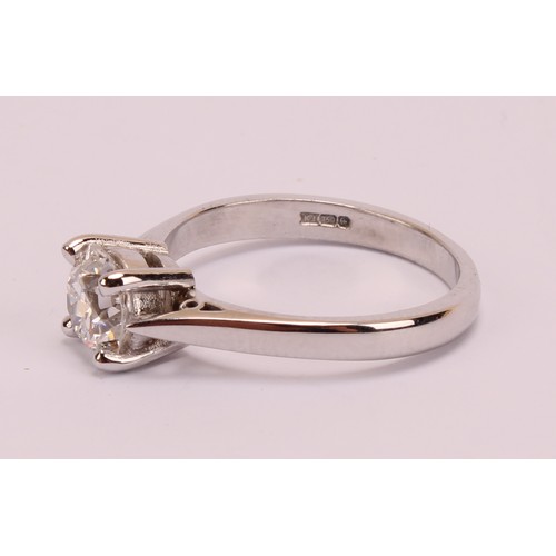 184 - An 18ct white gold and platinum diamond solitaire ring, 18ct white gold mount with platinum four cla... 
