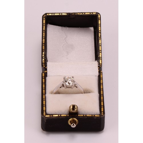 184 - An 18ct white gold and platinum diamond solitaire ring, 18ct white gold mount with platinum four cla... 