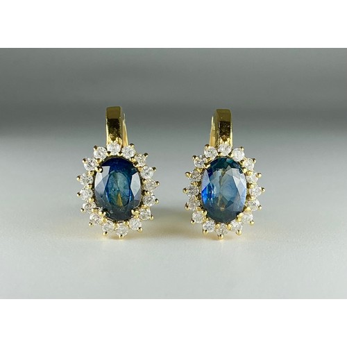130 - A pair of 18ct gold sapphire and diamond cluster earrings, each earring set with an approx. 0.80ct m... 