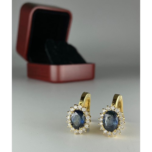 130 - A pair of 18ct gold sapphire and diamond cluster earrings, each earring set with an approx. 0.80ct m... 