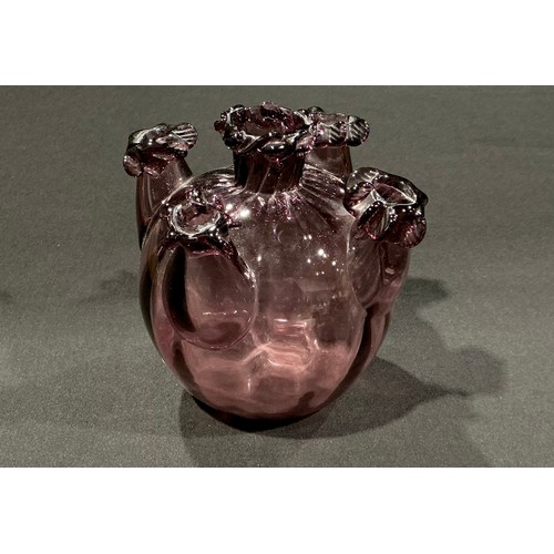 126 - Vittorio Zecchin (1878 - 1947) for Venini, Murano, a soffiato amethyst glass ovoid bud vase, spirall... 