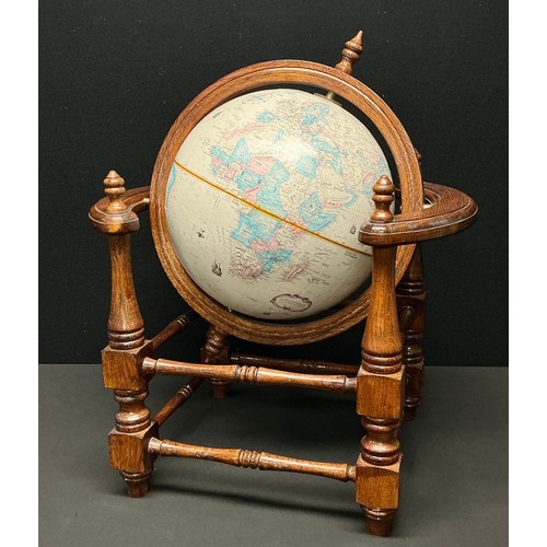 166 - A Globemaster terrestrial table top globe, 12 inch (30.5cm diameter) turned oak stand