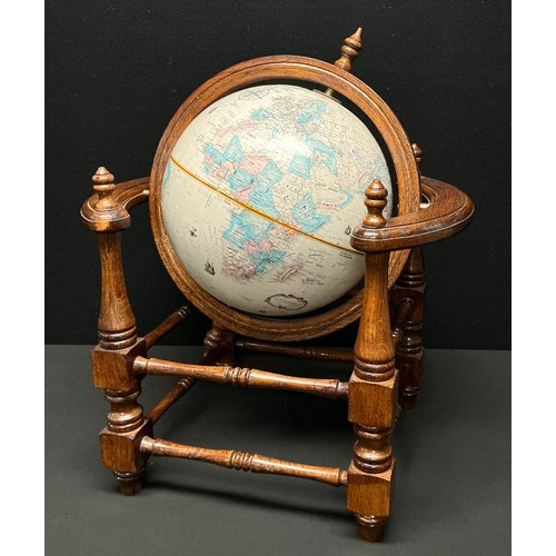 166 - A Globemaster terrestrial table top globe, 12 inch (30.5cm diameter) turned oak stand