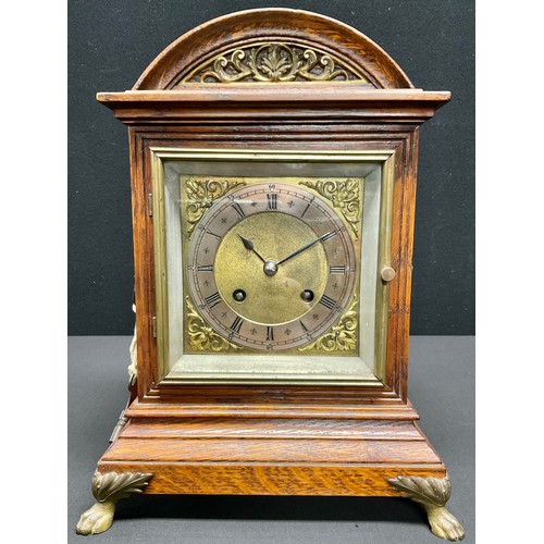 171 - An early 20th century oak arch topped bracket clock, rectangular brass dial with silvered chapter, R... 