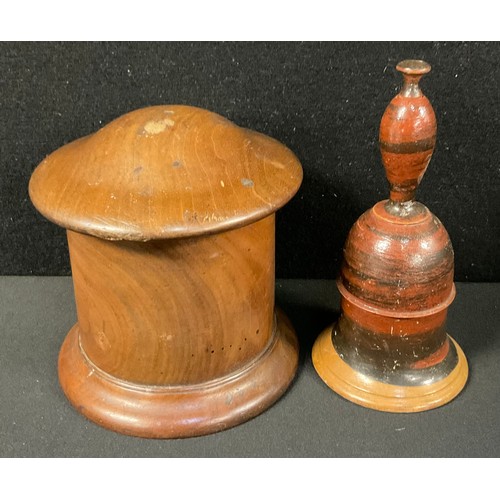 174 - Treen - a 19th century lignum vitae string box, 13cm high; another, a child’s painted wooden bell, 1... 