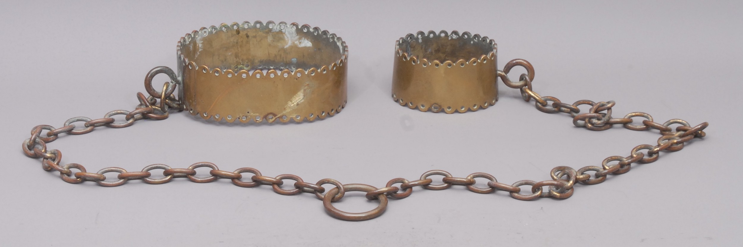 Crime and Punishment - a set of 19th century brass and iron mannacles ...