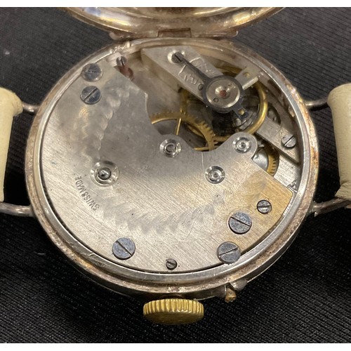 307 - A WWI hallmarked silver trench wristlet watch, 30mm white enamel dial, Arabic numerals, London impor... 