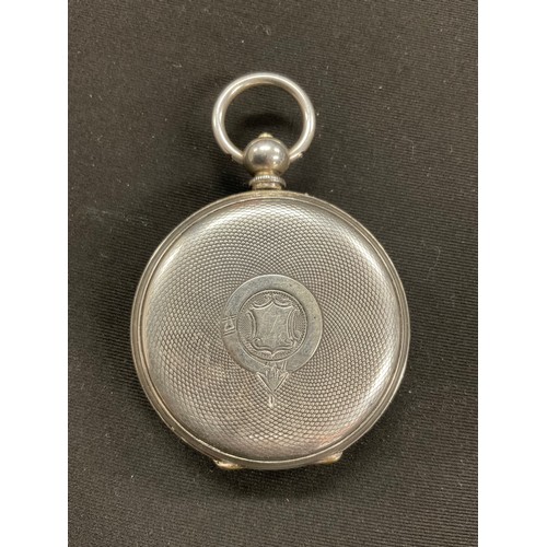 316 - An ornate silver cased pocket watch, 47mm silvered face with secondary seconds dial, Roman numerals,... 