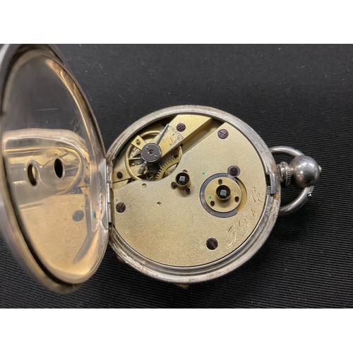 316 - An ornate silver cased pocket watch, 47mm silvered face with secondary seconds dial, Roman numerals,... 