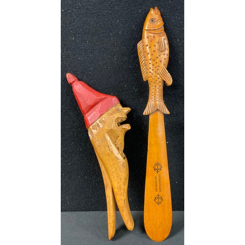 279 - Treen - a novelty wooden nutcracker, as a grotesque gnome or dwarf, 19.5cm long; another, a fish pag... 