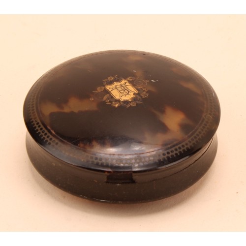 286 - A George III tortoise shell circular box and cover, inlaid with a central gold shield shaped cartouc... 