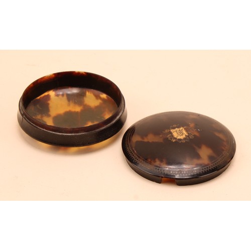 286 - A George III tortoise shell circular box and cover, inlaid with a central gold shield shaped cartouc... 