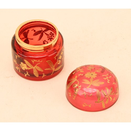 286 - A George III tortoise shell circular box and cover, inlaid with a central gold shield shaped cartouc... 