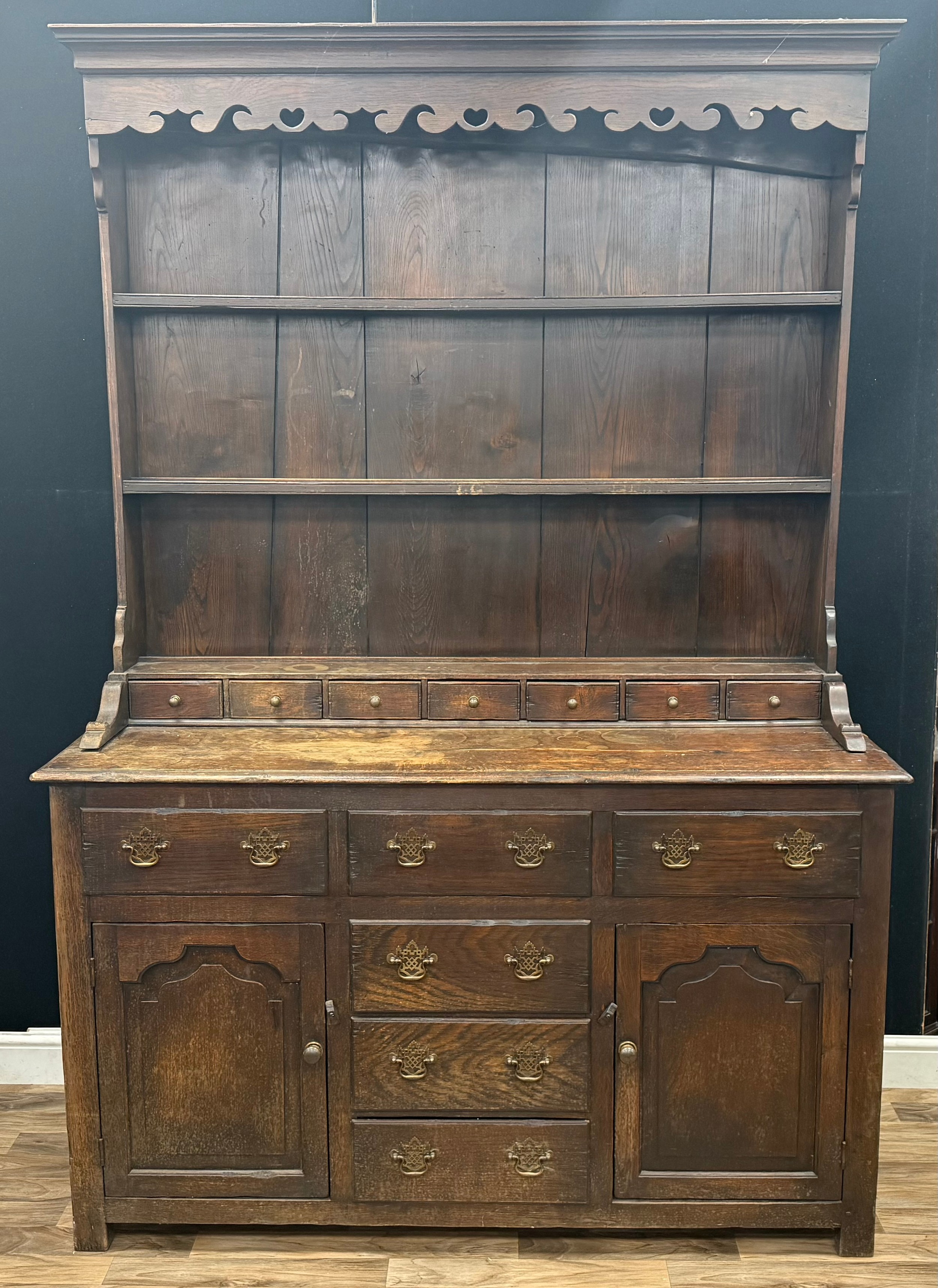 A George lll oak Welsh dresser, oversailing cornice with shaped apron ...