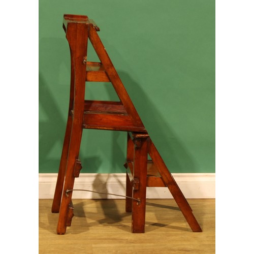 1 - An Arts & Crafts metamorphic library step chair, rectangular cresting and mid rail pierced with quat... 