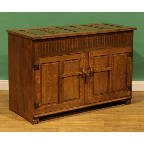6 - An oak side cabinet, probably Nigel Griffiths Monastic Woodcraft, 80.5cm high, 118cm wide, 54cm deep