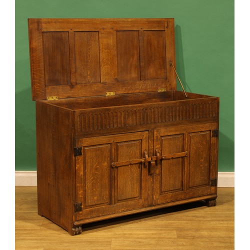 6 - An oak side cabinet, probably Nigel Griffiths Monastic Woodcraft, 80.5cm high, 118cm wide, 54cm deep
