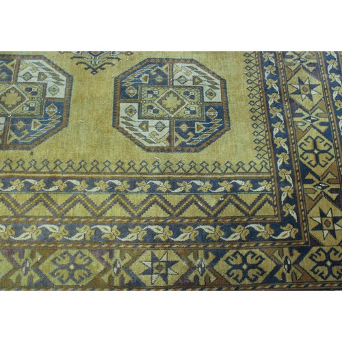 A Middle Eastern design rug or carpet, the verso worked in blue with ...