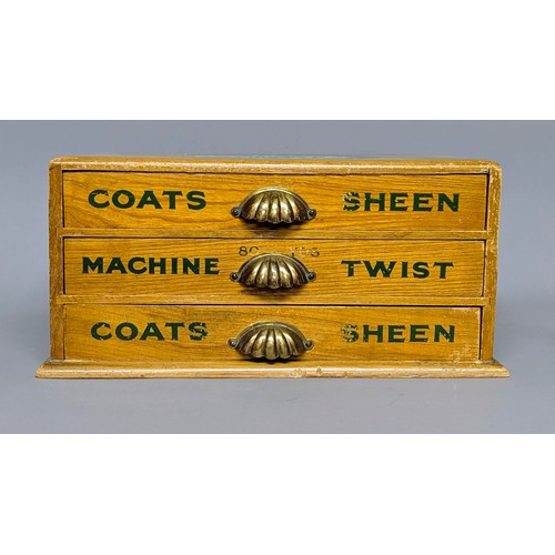 3018 - An early 20th century elm three draw shop counter display rectangular cotton reel box, J & P Coates,... 