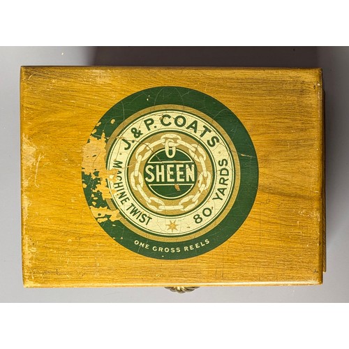 3018 - An early 20th century elm three draw shop counter display rectangular cotton reel box, J & P Coates,... 