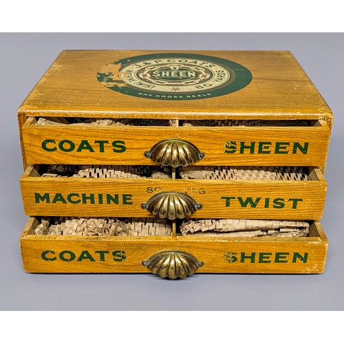 3018 - An early 20th century elm three draw shop counter display rectangular cotton reel box, J & P Coates,... 