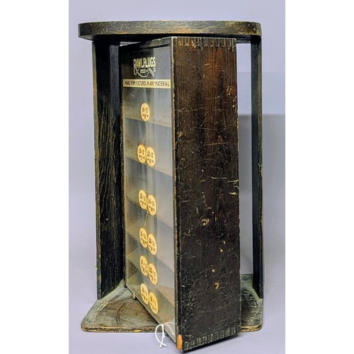 3020 - Advertising - a mid 20th century counter top revolving shop display stand, Rawlplugs, Make Firm Fixt... 