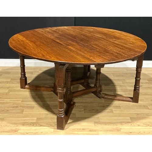 2 - An oak double-gateleg dining table, probably Nigel Griffiths Monastic Woodcraft, signed, 72cm high, ... 