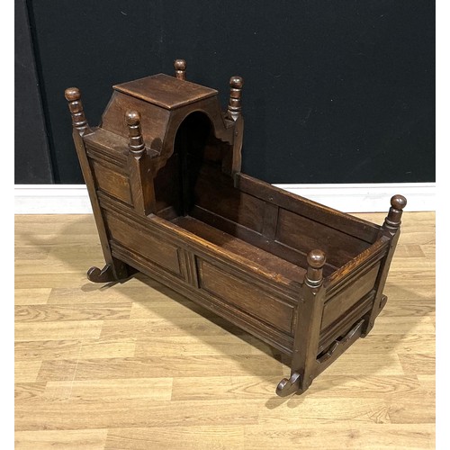 3 - An oak rocking crib, by Nigel Griffiths Monastic Woodcraft, signed, 88cm long
