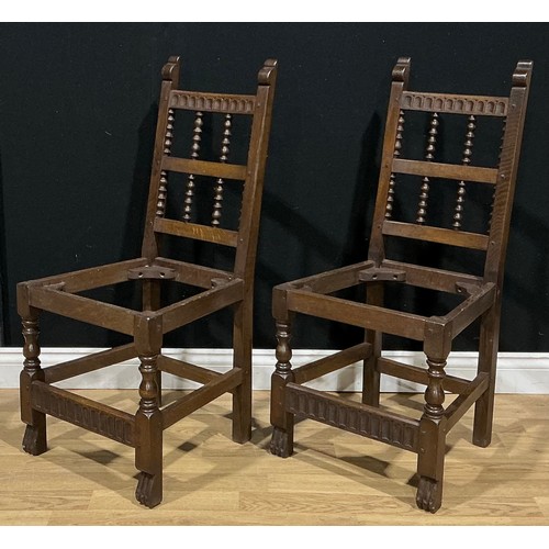 5 - A pair of oak spindle back dining chairs, number 79 by Nigel Griffiths Monastic Woodcraft, signed (2... 