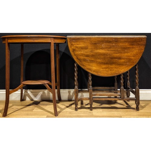115 - An Edwardian mahogany oval occasional table; a barley twist gateleg table (2)
