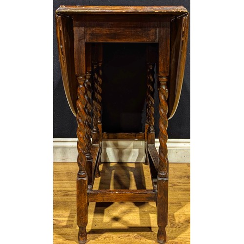 115 - An Edwardian mahogany oval occasional table; a barley twist gateleg table (2)