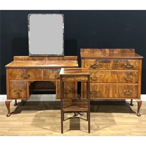 116 - A walnut veneer dressing table, 106.5cm wide; a similar chest of three long drawers and bedside lamp... 