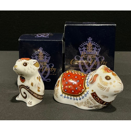 33 - A Royal Crown Derby paperweight, Guinea Pig, gold stopper, 11cm long, printed mark in red, boxed; an... 