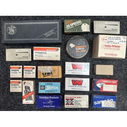 A collection of empty cardboard and plastic ammunition and primer boxes ...