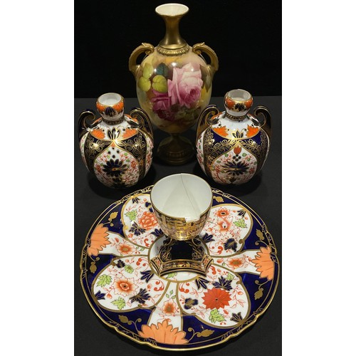 63 - A pair of Derby Crown Porcelain Company Imari palette globular vases, pattern number 867, 13cm, prin... 