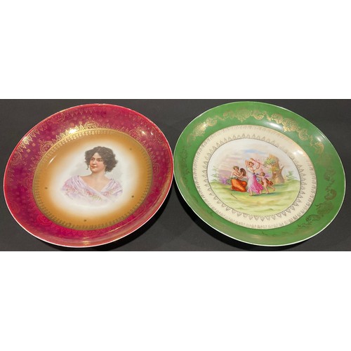 71 - A large Vienna charger, printed and painted with scenes after Kaufmann, 34.5cm wide, beehive mark in... 