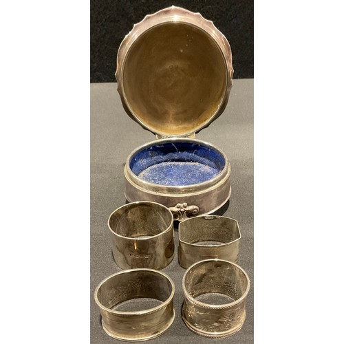 77 - silver - four Edwardian and later silver napkin rings, mixed dares and makers inc George Unite 1917 ... 