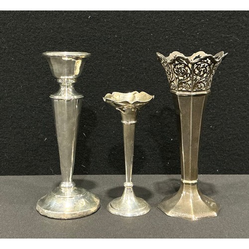 86 - A George V octagonal silver trumpet vase, pierced scrolling out-swept collar, weighted base, 16.5cm ... 