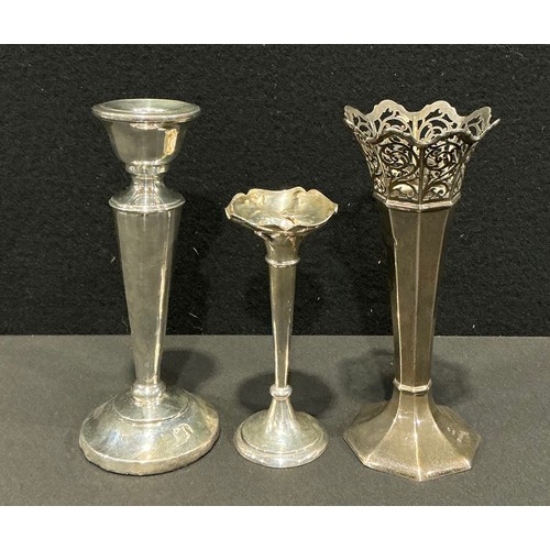 86 - A George V octagonal silver trumpet vase, pierced scrolling out-swept collar, weighted base, 16.5cm ... 