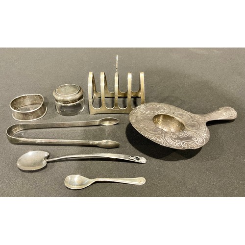 99 - A late 19th century continental silver tea strainer, embossed with scallops and scrolls, 15cm, impor... 