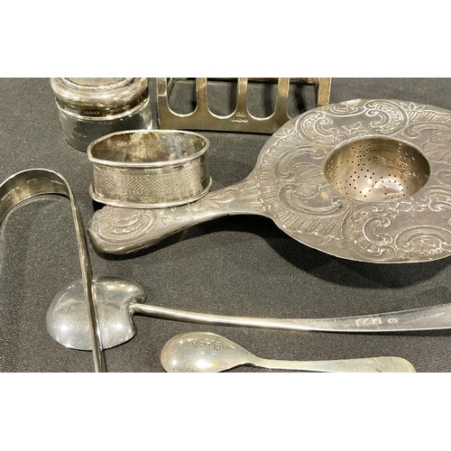 99 - A late 19th century continental silver tea strainer, embossed with scallops and scrolls, 15cm, impor... 