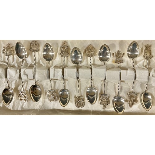 100 - A set of eleven Chinese silver souvenir teaspoons, indistinctly marked to verso, 88.6g